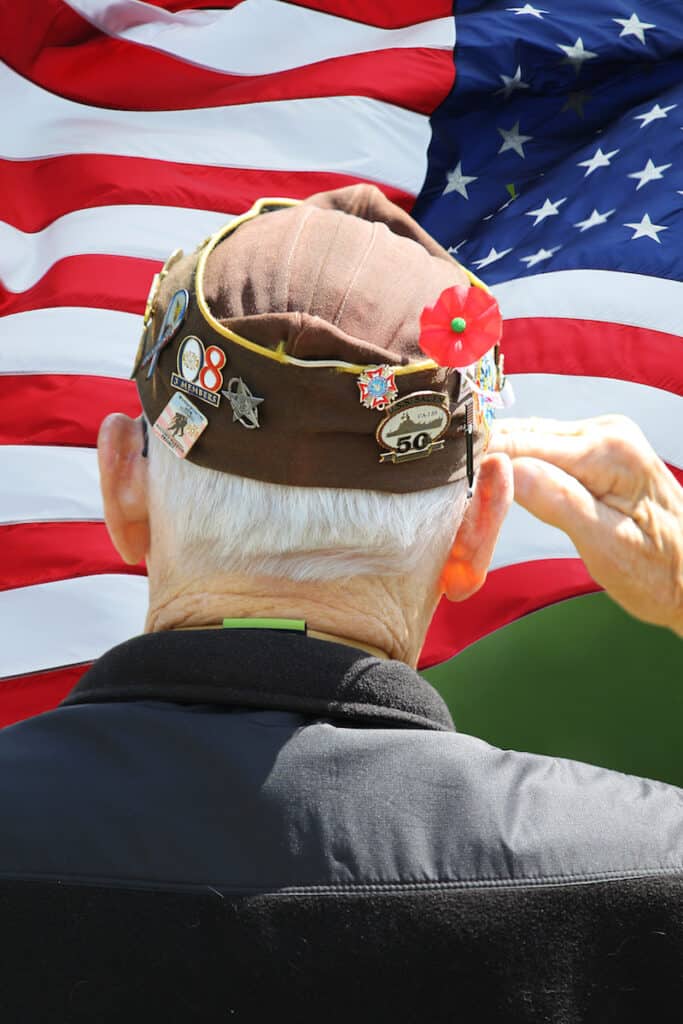 Veteran saluting the flag.